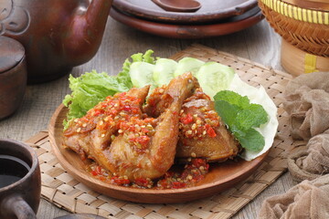 Ayam penyet  is Indonesian fried chicken dish consisting of fried chicken that is smashed with the...