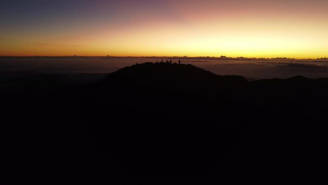 Aerial video of Mount Pulag at sunset with people in the background, the third highest mountain 
