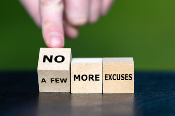 Hand turns a wooden cube and changes the expression 'a few more excuses' to 'no more excuses'.
