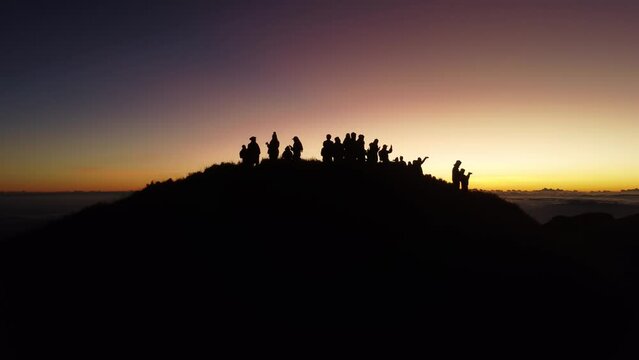 Aerial video of Mount Pulag at sunset with people in the background, the third highest mountain 