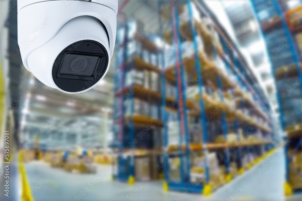 Poster closed circuit camera multi-angle cctv system against the background of a modern warehouse complex. 