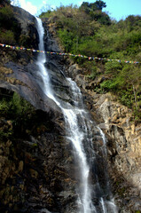 Blurred motion of a waterfall in Lachung North Sikkim India. Cascade and Rocks