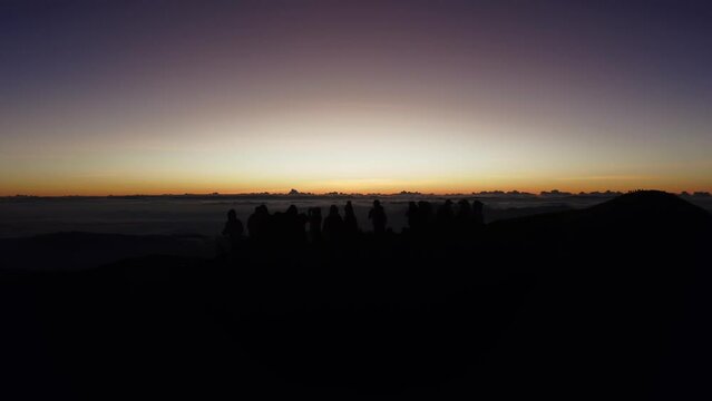 Aerial video of Mount Pulag at sunset with people in the background, the third highest mountain 