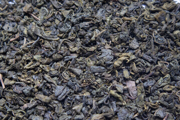 Green Tea background. Close-up shot of dry green tea