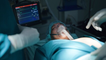 Dead patient surgeon doctor covering face on bed finished operate in emergency room at hospital,...