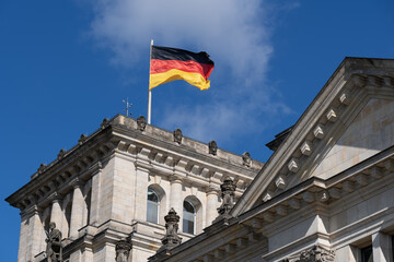 Fototapeta na wymiar National Flag of Germany on Reichstag in Berlin, Germany