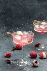 Delicious lychee cocktails. Freeze motion splash drops of lychee drink. vertical image. place for...