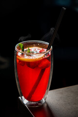 cocktail with red berries and fruits
