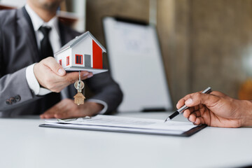 Real estate company to buy houses and land are delivering keys and houses to customers after...
