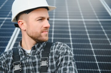 Worker installing solar panels outdoors