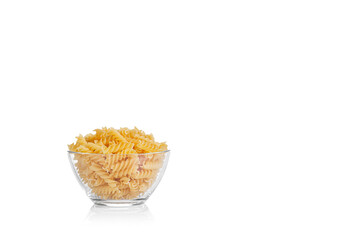 Pasta products in the form of a spiral on a plate, texture, on a white background