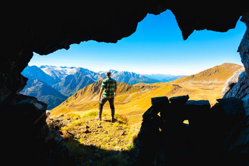 Hiker in Stelvio national park in Ponte di Legno, Brescia province in Lombardy district, Italy.