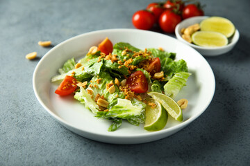 Healthy green salad with cherry tomatoes and peanut