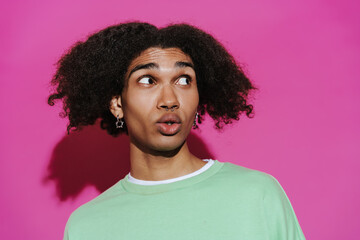 Portrait of young stylish curly african man with piercing