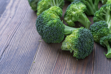 A lot of broccoli for diet and healthy eating. Fresh green broccoli on a   table.Broccoli vegetable is full of vitamin.Vegetables for diet and healthy eating.Organic food