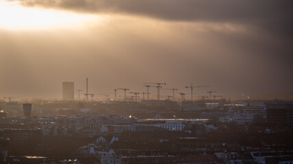 Silhouette of many cranes at a construction site in Hamburg. Germany.