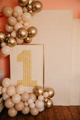Background with balloons in yellow and gold colors for the first birthday