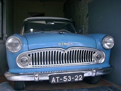 Old light blue Simca in a garage