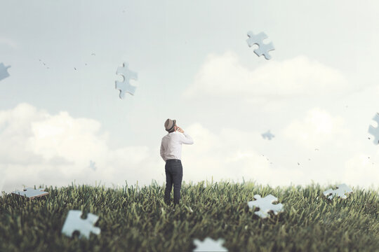 man observing pieces of puzzle falling from the sky surreal concept