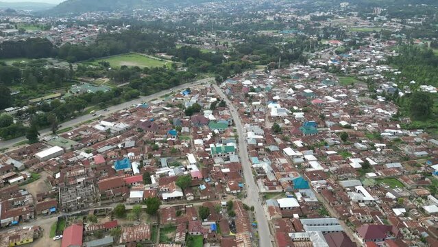 Aerial view of Mbeya city in Tanzania, Africa. Town is located in south west of Tanzania. Narrow highland valley surrounded by a bowl of high mountains.