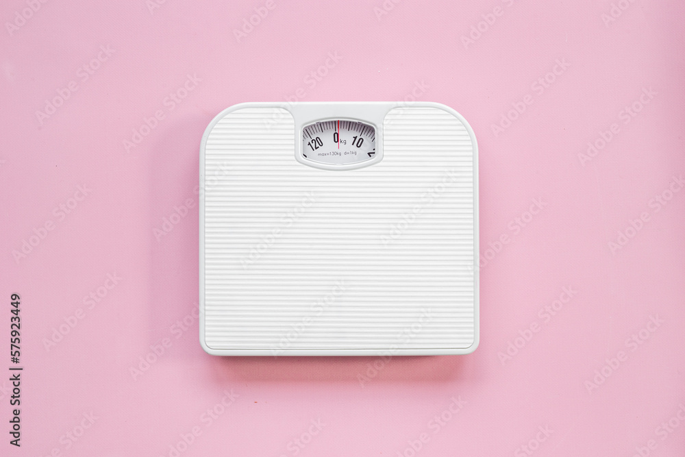 Wall mural White weight scales on the floor. Weight measurement and loss concept - Wall murals