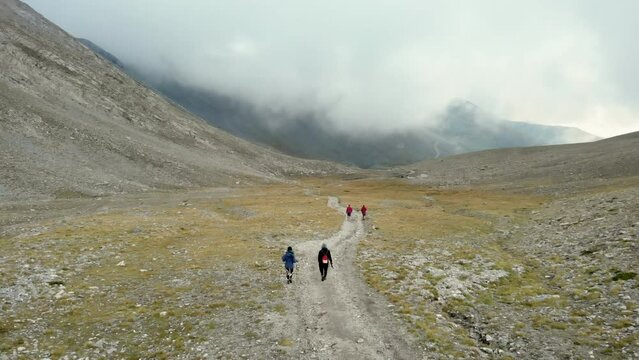 Drone Video following hikers walking Mountain trail Olympus Greece Christakis e4