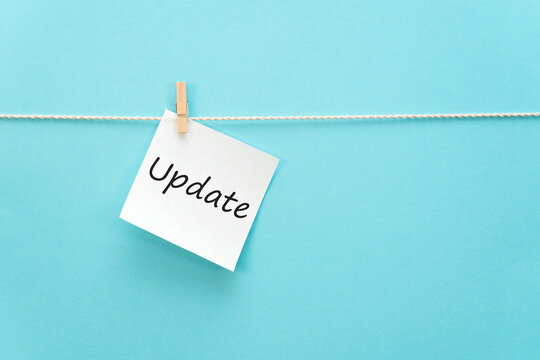 White sticker on a rope with a clothespin with an inscription