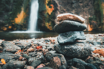 stone tower with waterfall, horizontal closeup 