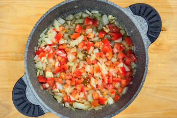 Raw ingredients. Ready to be cooked. Recipe for chiken stew, European cuisine, cooked with a garnish of mushrooms, small onions and ohter.