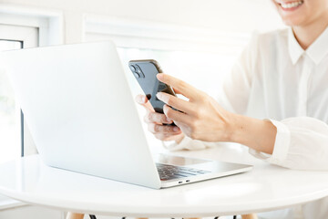 woman work using texting cell phone typing computer.student study education online learning.adult professional chatting on laptop,mobile contact us at Thinking business plan.connecting people concept