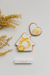 Women's Day, March 8, figure eight, gingerbread, flowers. Space for text.