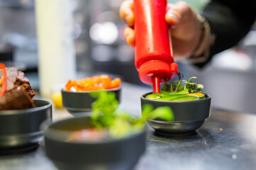 Chef cooking vegetables salad on restaurant kitchen