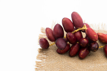 Obraz premium Raw dates palm dates isolated on white background.
