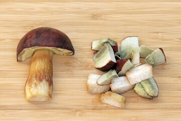 Half and sliced edible mushroom Imleria badia, commonly known as bay bolete. Pores and flesh stain...