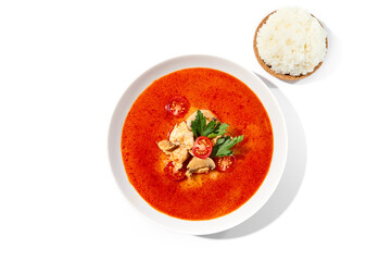 Traditional thai soup tom yam with chicken meat on white background. Tom kha in minimal style with chicken and mushrooms. Asian soup with spicy and chicken isolation on white background