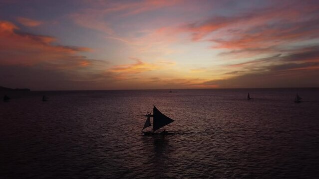 Traditional Filipino boats sail El Nido in sunset lights. Palawan Island, Philippines