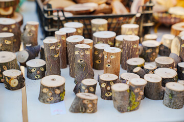 small logs with painted faces. cute souvenirs and crafts made.
