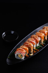 Salmon Sushi roll Japanese food isolated in black background