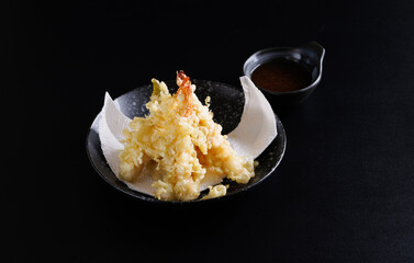 Shrimp tempura Japanese food isolated on a black background