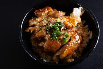 Grilled Chicken teriyaki rice Japanese food isolated in black background