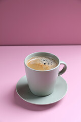 Black coffee white cup isolated on pink background