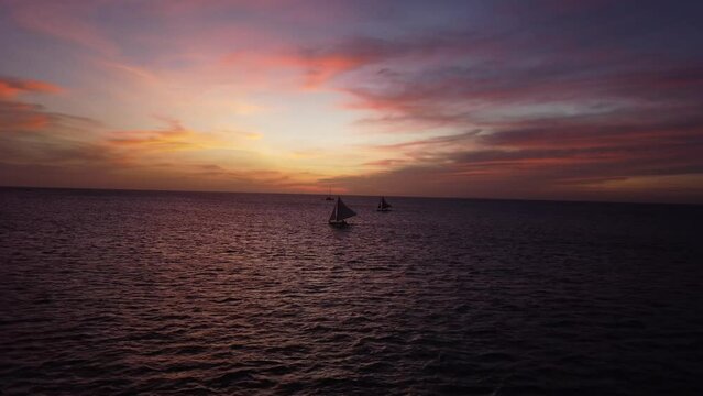 Traditional Filipino boats sail El Nido in sunset lights. Palawan Island, Philippines