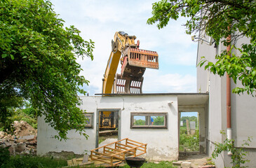 Demolition of a garden house through a digger in Austria