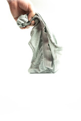Hand holding men gray old underware or old underpants on a white background