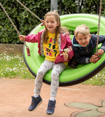 Children playing in the park in spring