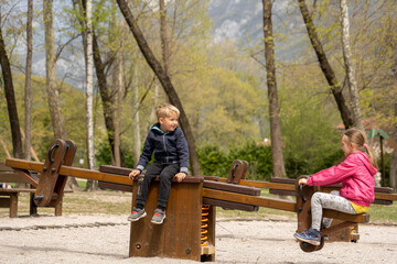 Children playing in the park in spring