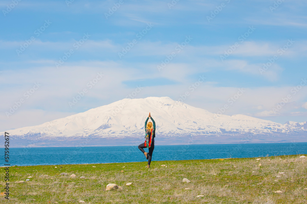 Wall mural girl doing yoga and walking around mount ararat