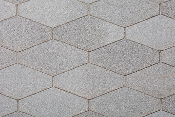 Background and texture of gray diamond-shaped bituminous slabs for arranging the surface of the roof of buildings.