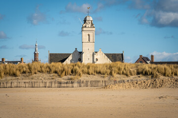 White church at dutch seaside resort Katwijk aan Zee seen from the sandy beach