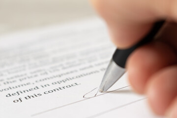 The employee signs the contract. Close-up - obrazy, fototapety, plakaty